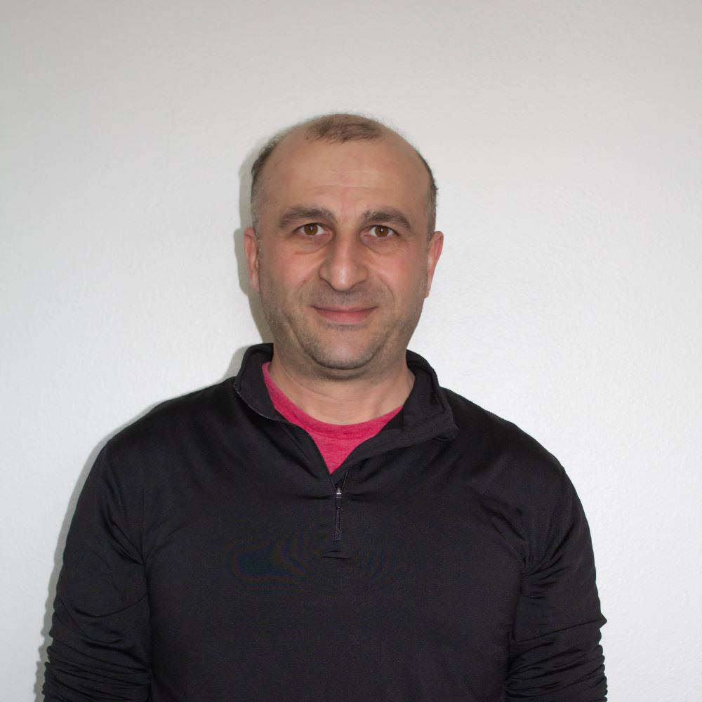 Portrait of Levan, EDI's Repair Program Coordinator.